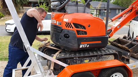 how to tie down mini excavator to trailer|how to tie down an excavator.